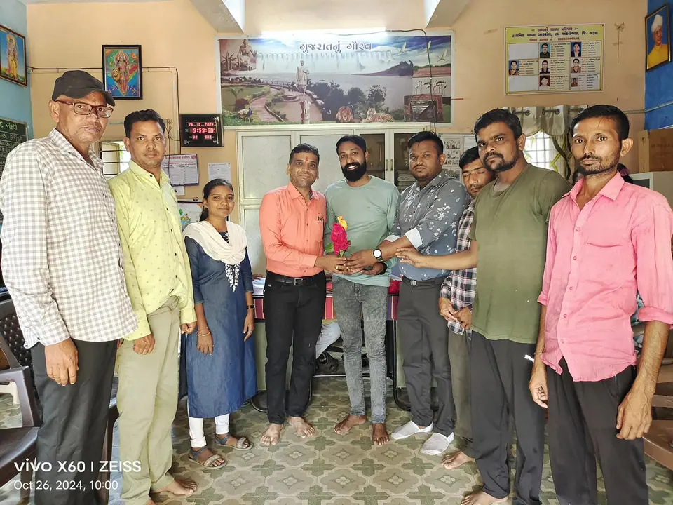 Group in office with handover