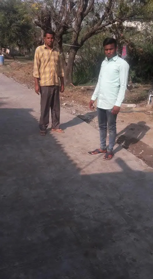 Two men on new CC road