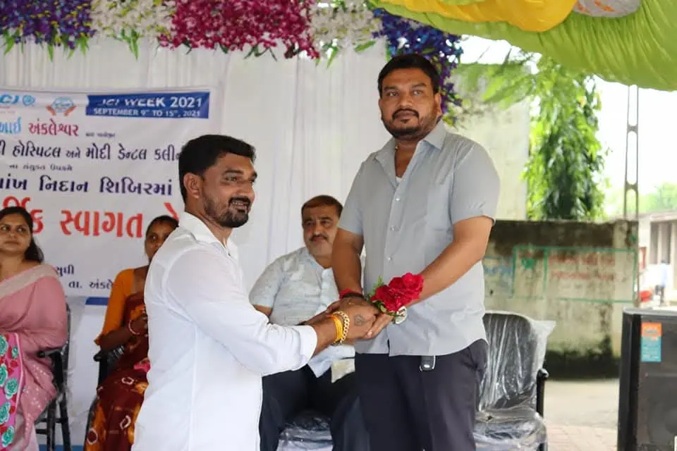 "Swagat" welcome with flower, banner "MY WEEK 2021" diagnosis camp