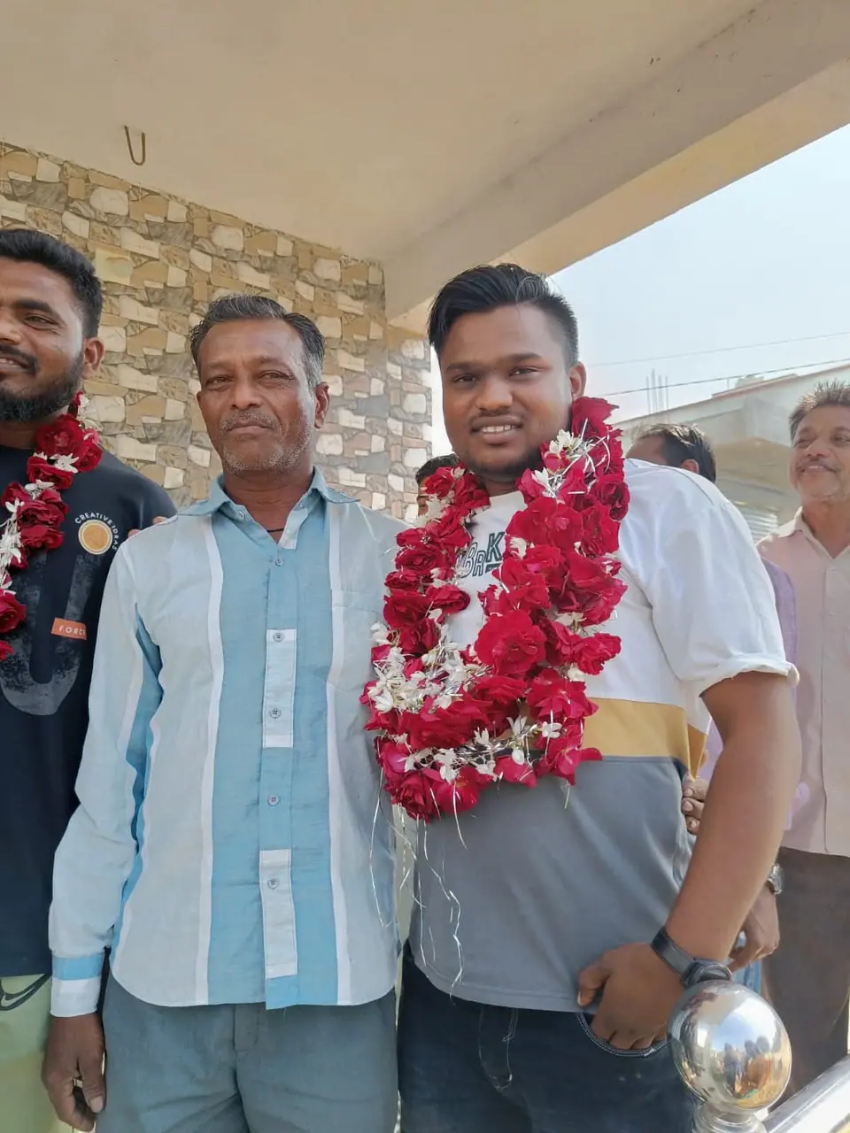 Man garlanded with rose garland
