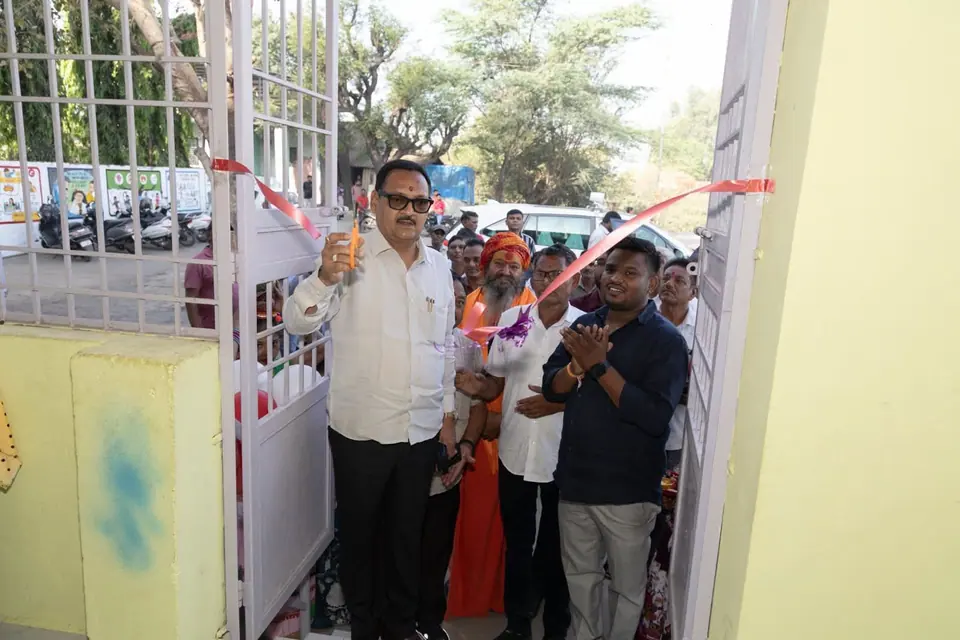 Ribbon cutting at a gate/building