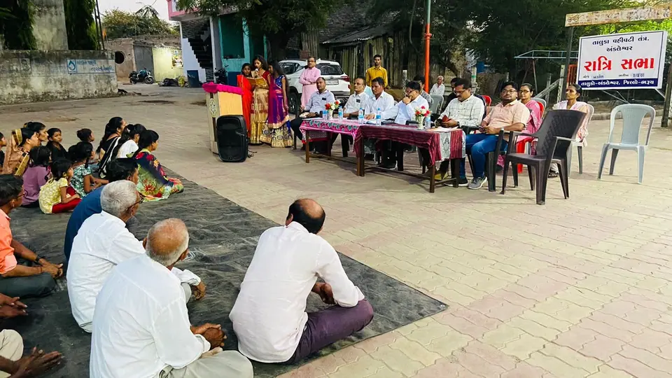 Gram sabha style meeting with banner