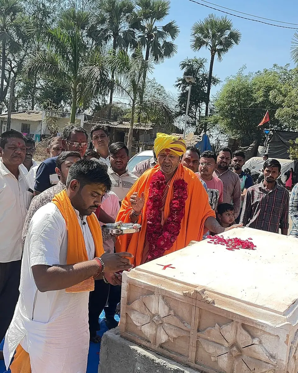 Puja at stone/foundation, garlanded elder