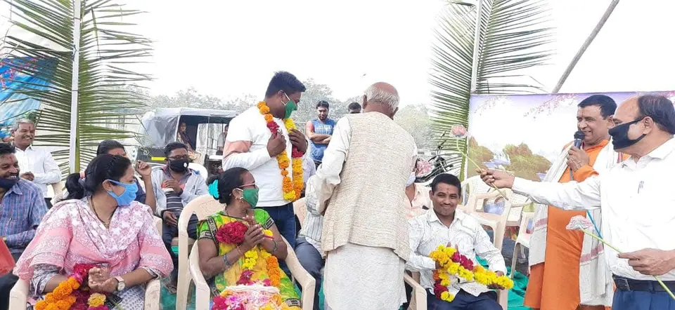Felicitation with garlands, sadhu