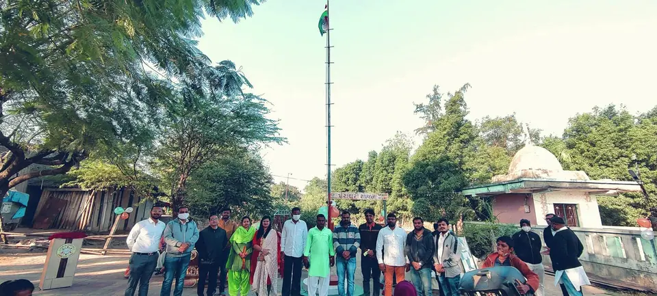 Group at flag pole by temple