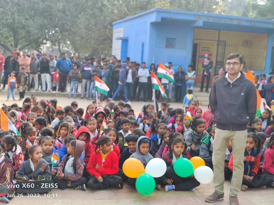 Children with flags, man standing