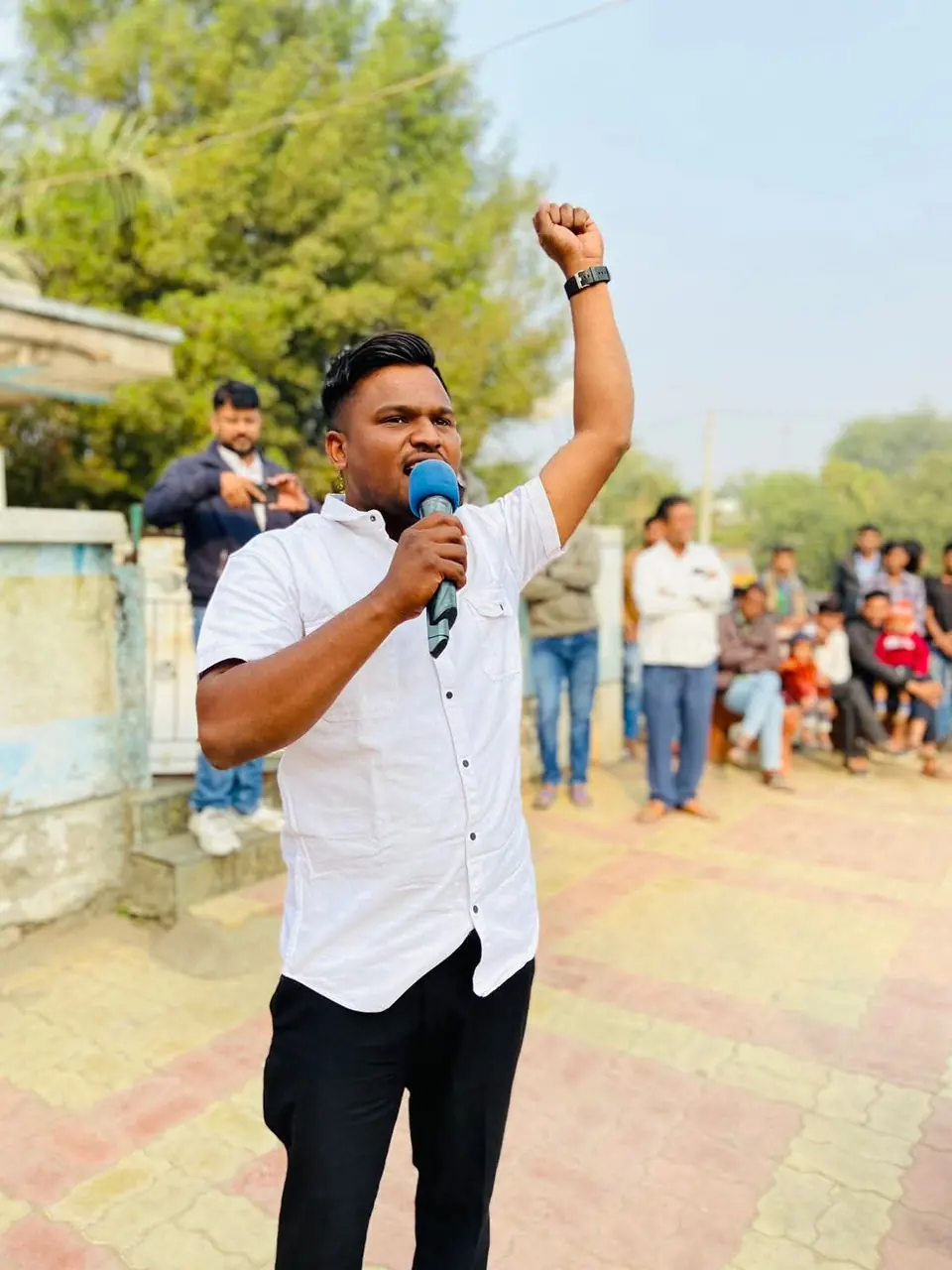 Man speaking energetically with mic