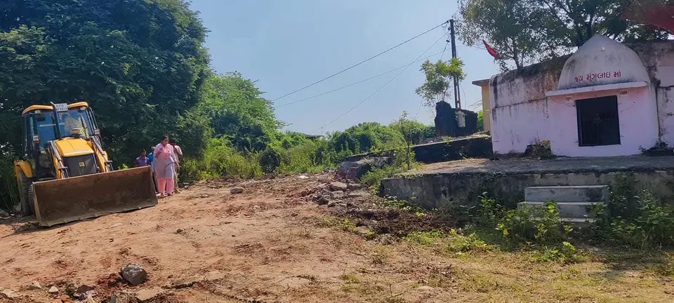 JCB near small temple