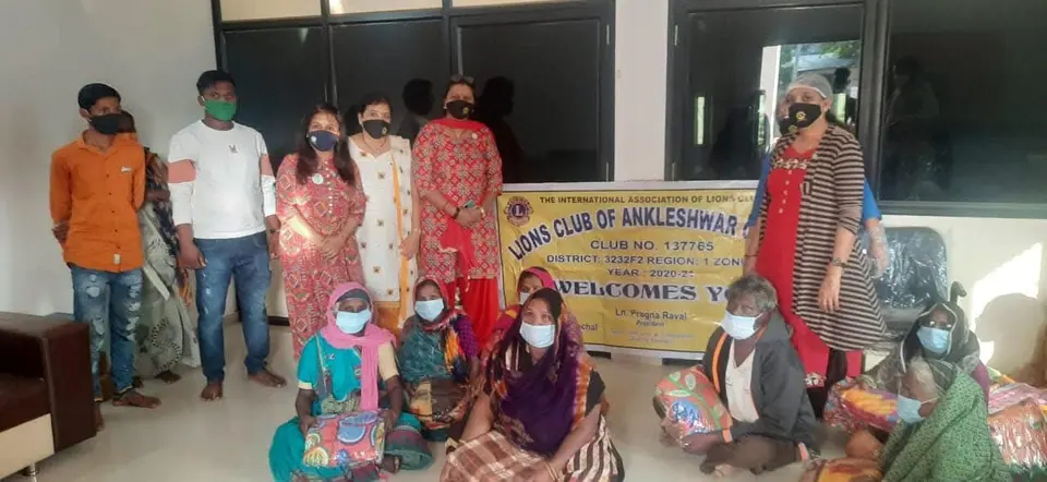Group with Lions Club of Ankleshwar banner, women