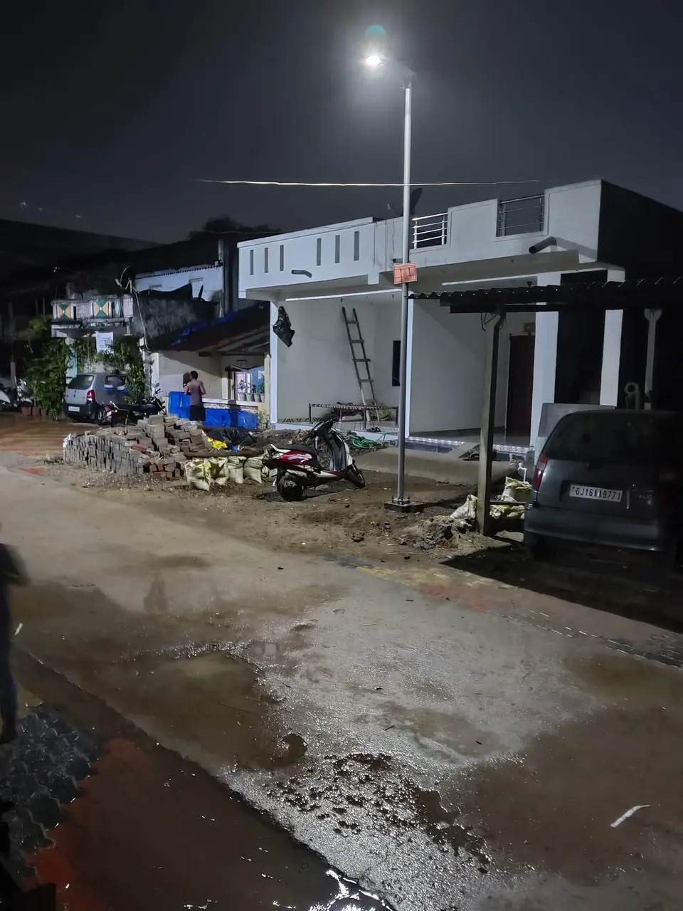 New street light at night on village road