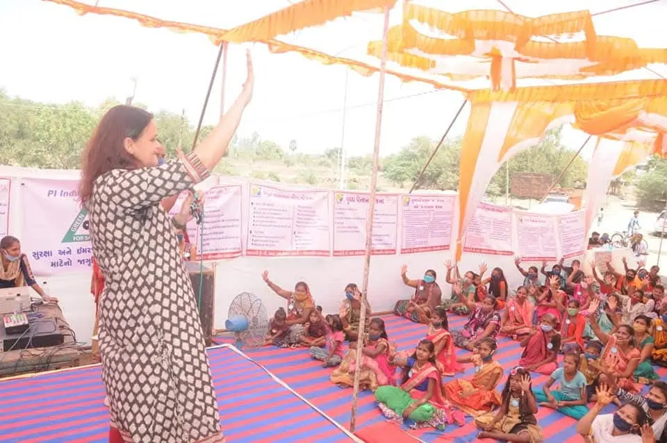 Woman speaking on stage, women"s programme